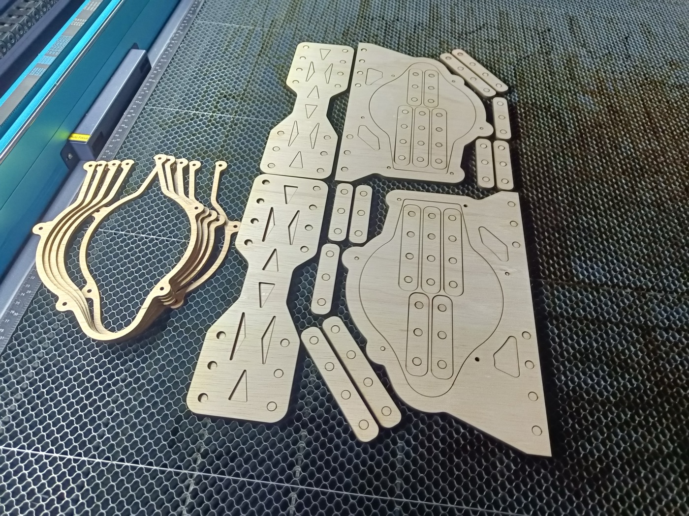 Laser-cut plywood layers of the mount